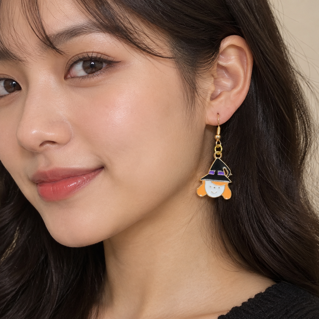 Woman wearing smiling witch girl enamel drop earrings