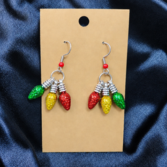 Woman wearing glitter Christmas light bulb cluster drop earrings