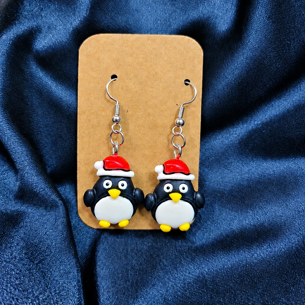 Christmas penguin Santa hat drop earrings on kraft card