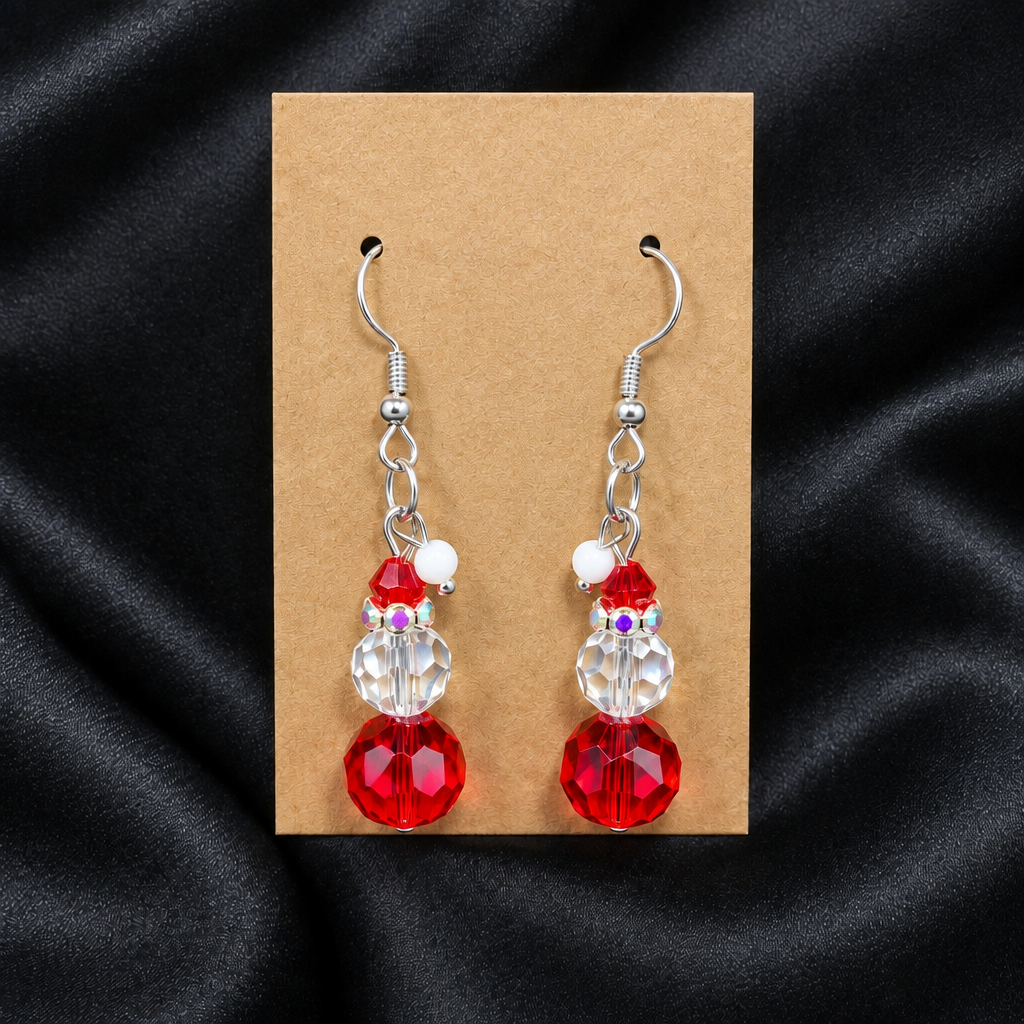 Woman wearing red crystal snowman beaded drop earrings