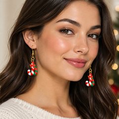 Enamel candy cane drop earrings on kraft card