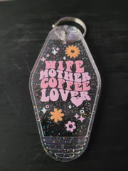 Wife Mother Coffee Lover clear glitter motel-style keychain with pink lettering and daisy accents