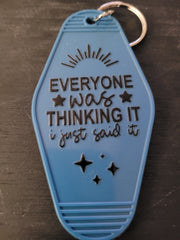 Everyone Was Thinking It I Just Said It slate blue motel-style keychain with sunburst and star accents
