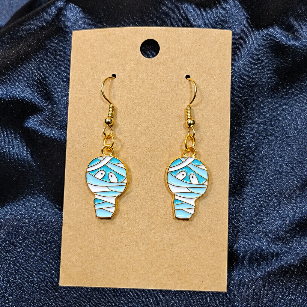 Mummy enamel drop earrings on kraft card