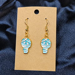 Mummy enamel drop earrings on kraft card