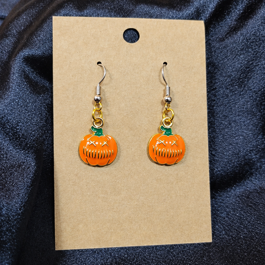 Grumpy pumpkin enamel drop earrings on kraft card