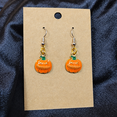 Grumpy pumpkin enamel drop earrings on kraft card