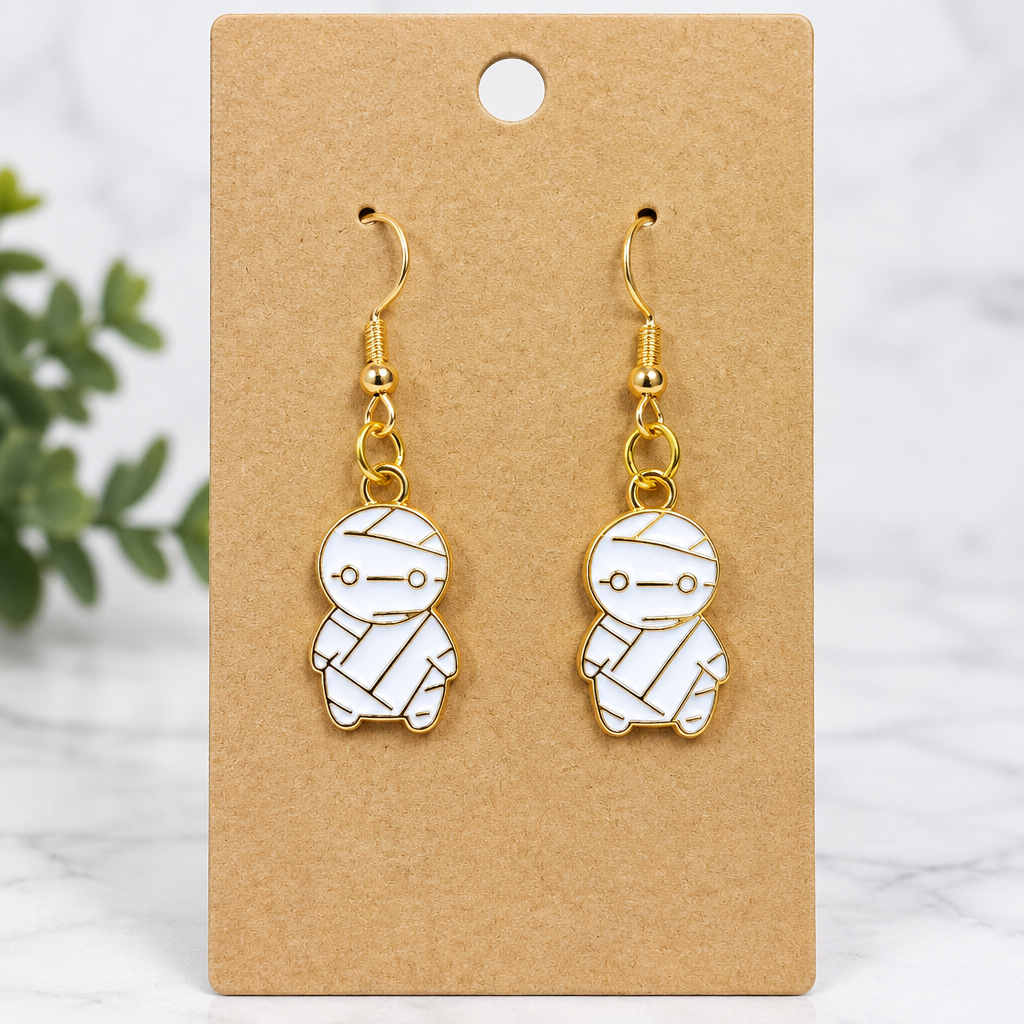 Chibi mummy enamel drop earrings on kraft card