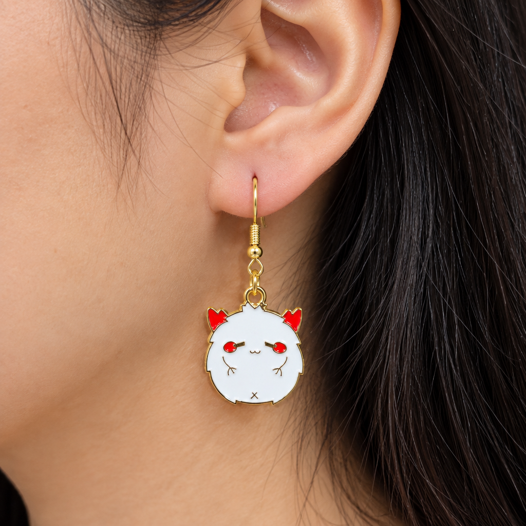 Woman wearing fluffy demon chibi enamel drop earrings