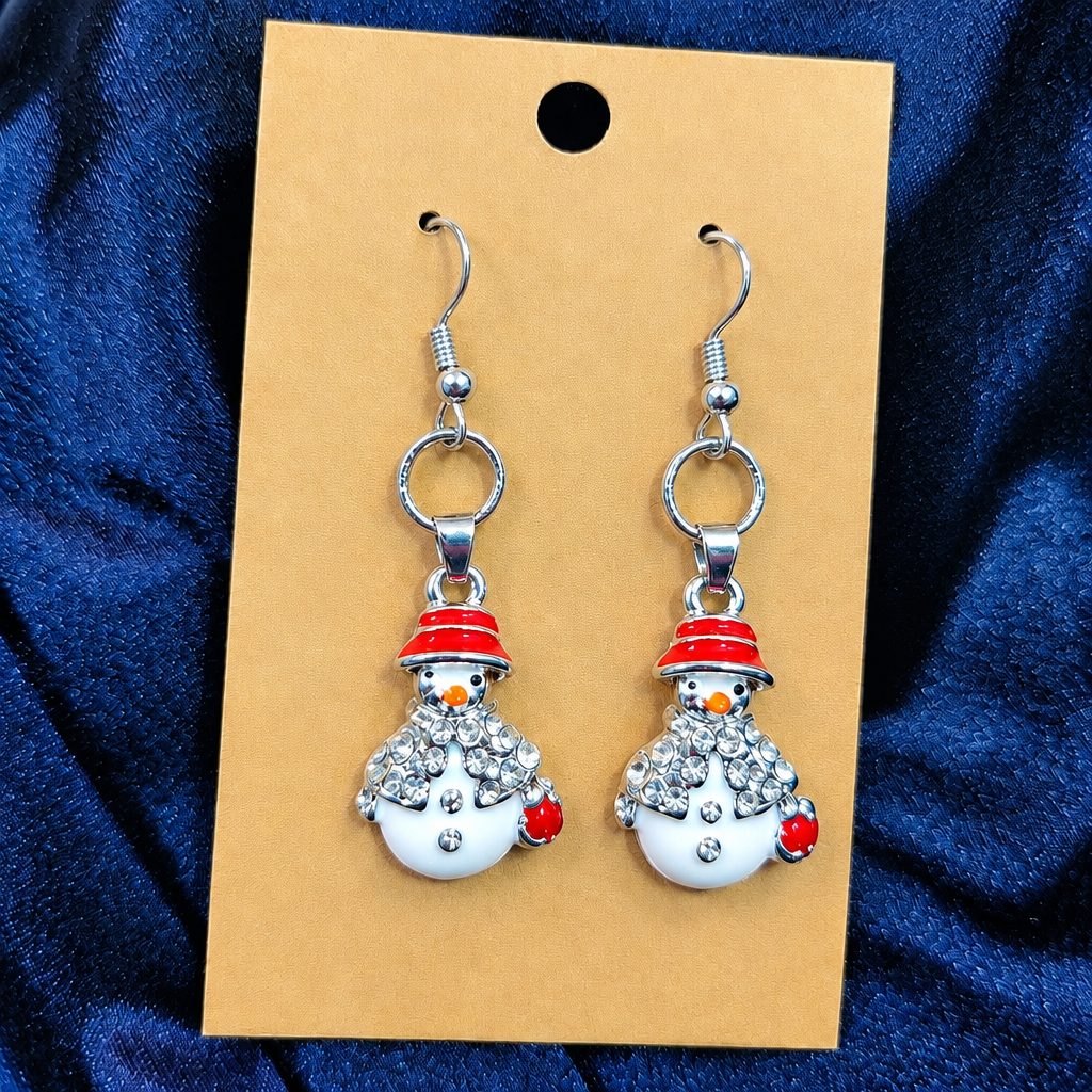 Woman wearing rhinestone snowman drop earrings