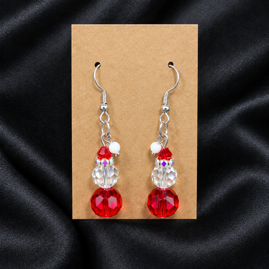 Woman wearing red crystal snowman beaded drop earrings