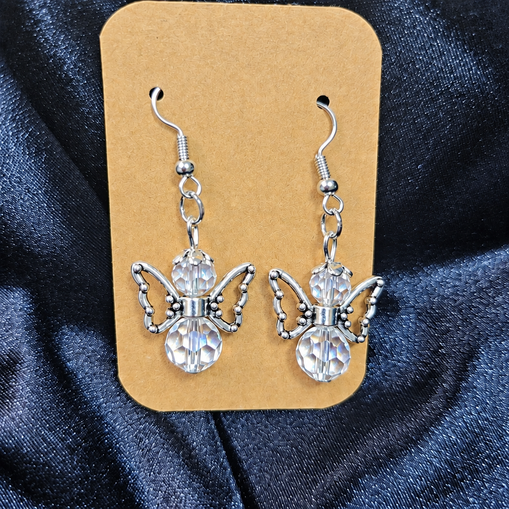 Woman wearing crystal angel beaded drop earrings