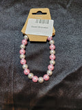 Pink and silver pearlescent bead stretch bracelet on display card
