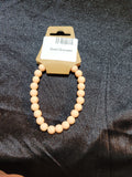 Blush nude matte bead stretch bracelet on display card
