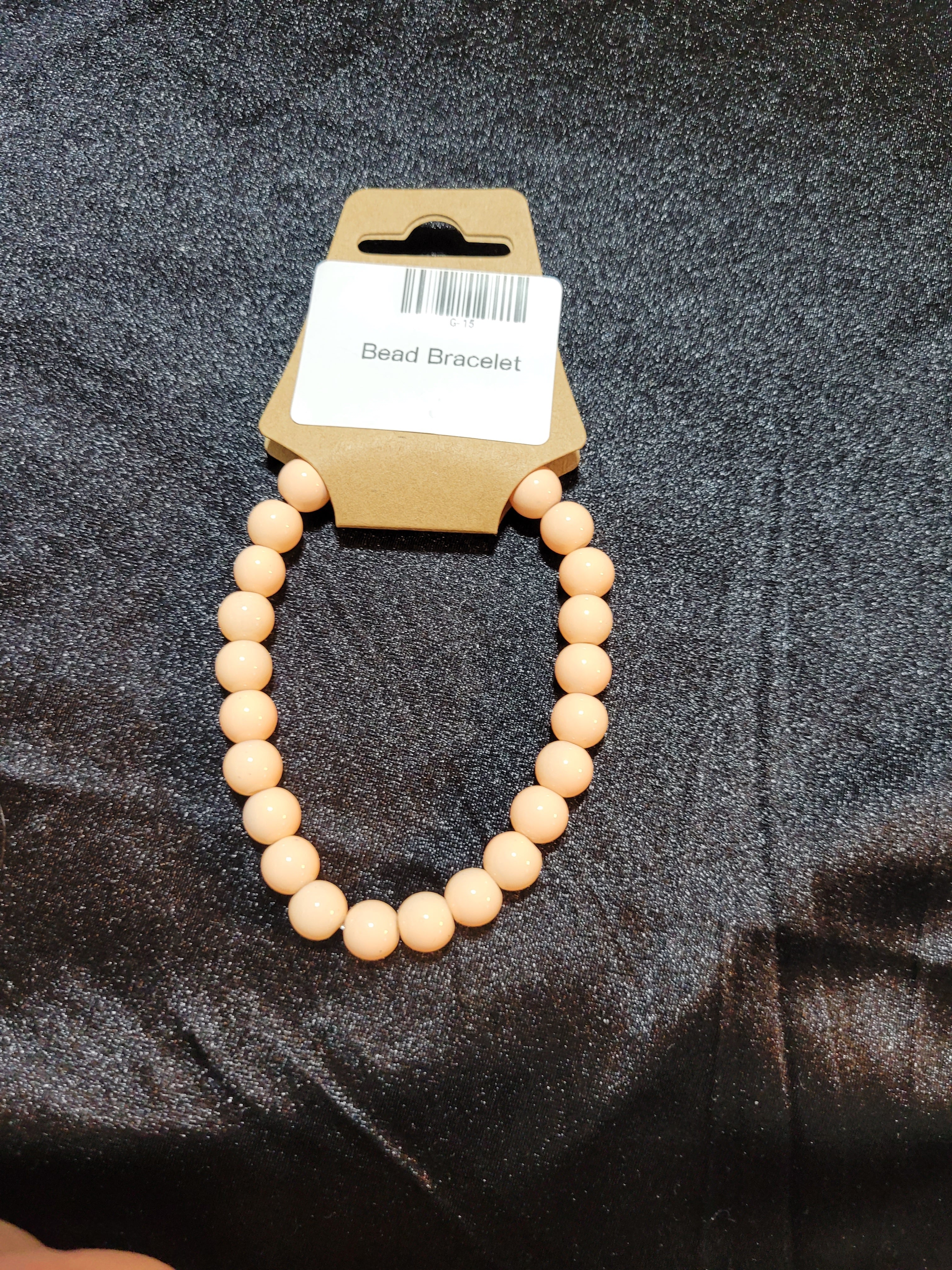 Blush nude matte bead stretch bracelet on display card