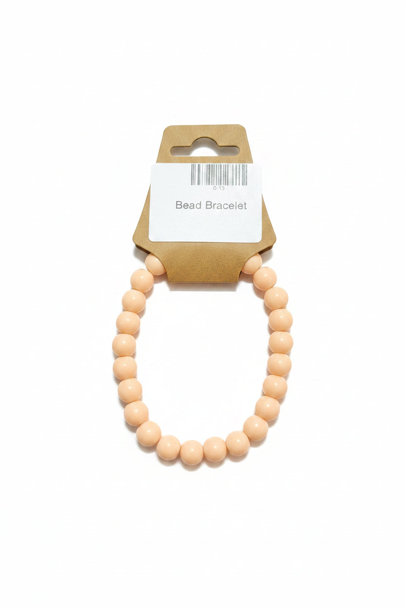 Blush nude matte bead stretch bracelet on display card