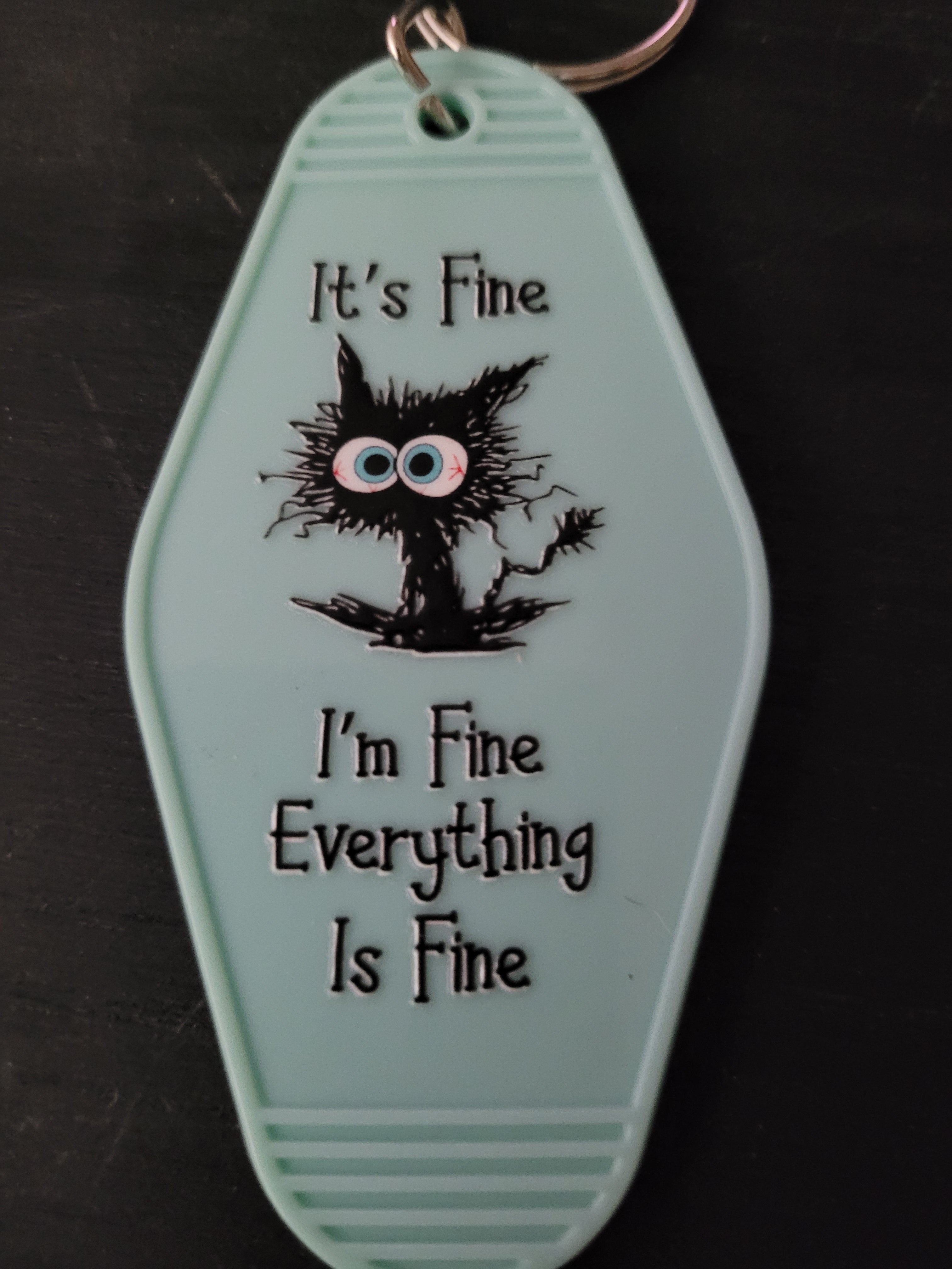 It's Fine I'm Fine Everything Is Fine mint green motel-style keychain with frazzled black cat