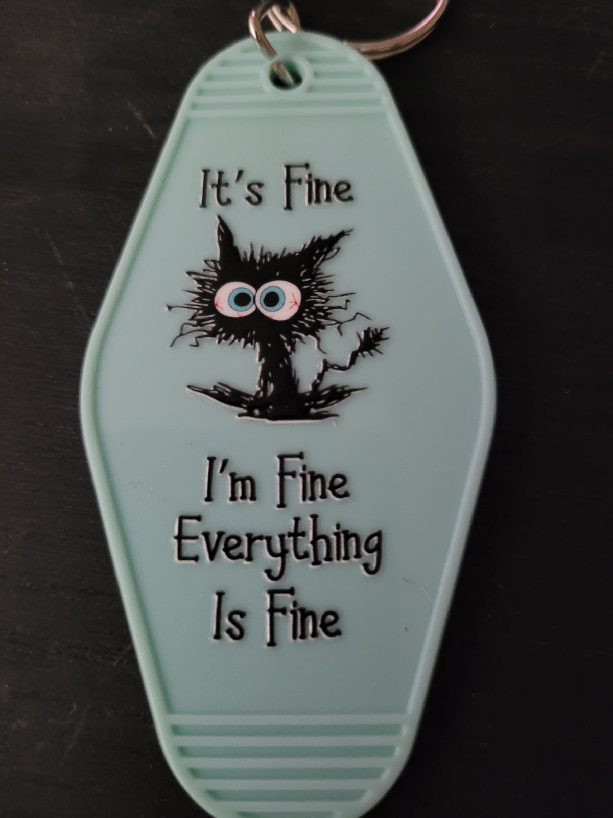 It's Fine I'm Fine Everything Is Fine mint green motel-style keychain with frazzled black cat