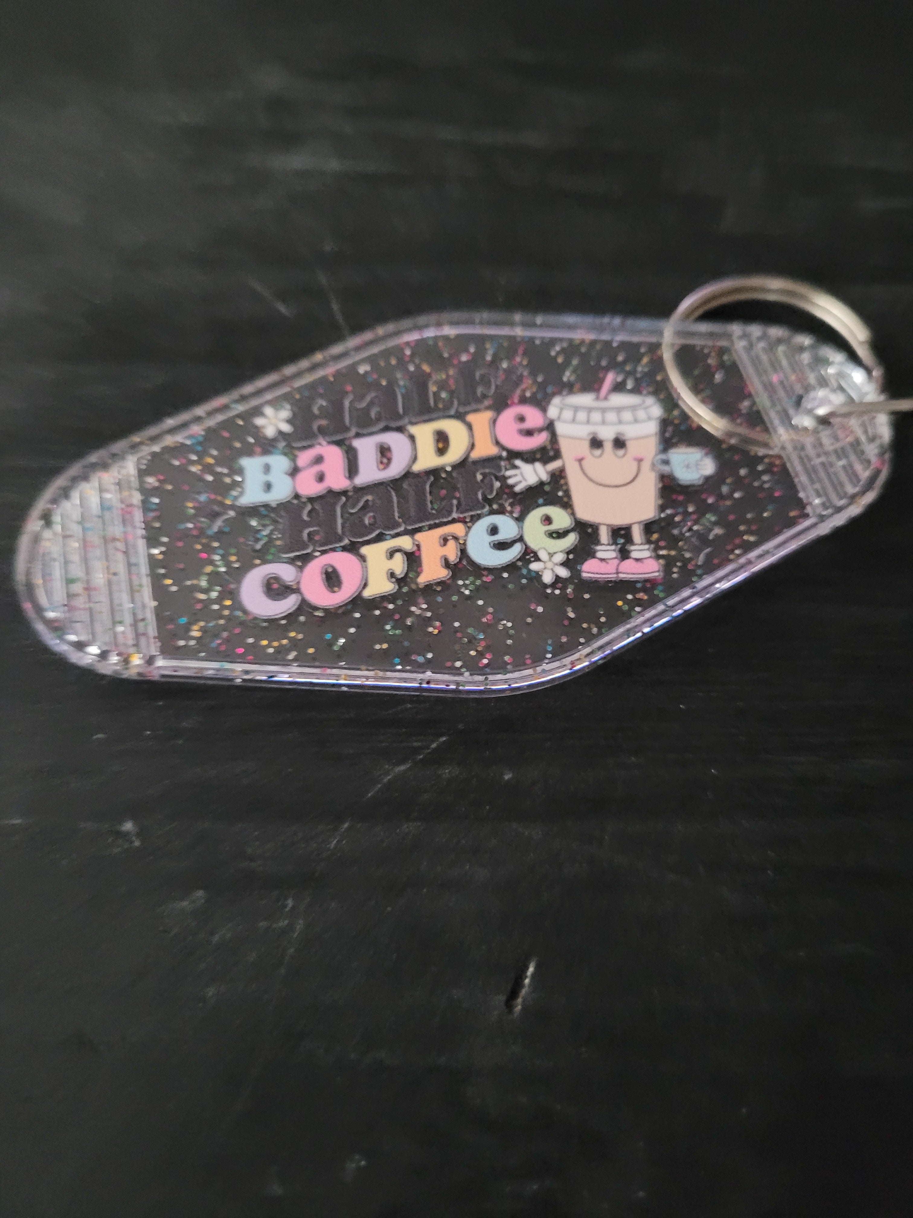 Baddie Coffee clear glitter motel-style keychain with pastel lettering and smiley coffee cup character