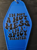 I'm Not A Hot Mess I'm A Spicy Disaster bold blue motel-style keychain with black retro lettering