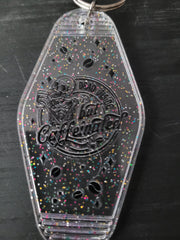 Dead Inside But Caffeinated clear rainbow glitter motel-style keychain with skeleton and coffee bean cutouts