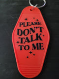 Please Don't Talk To Me bold red motel-style keychain with black lettering and sparkle star accents