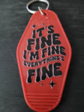 It's Fine I'm Fine Everything's Fine bold red motel-style keychain with groovy black lettering and sparkle accents