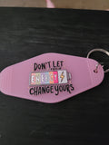 Don't Let Their Energy Change Yours lavender motel-style keychain with colorful battery and lightning bolt