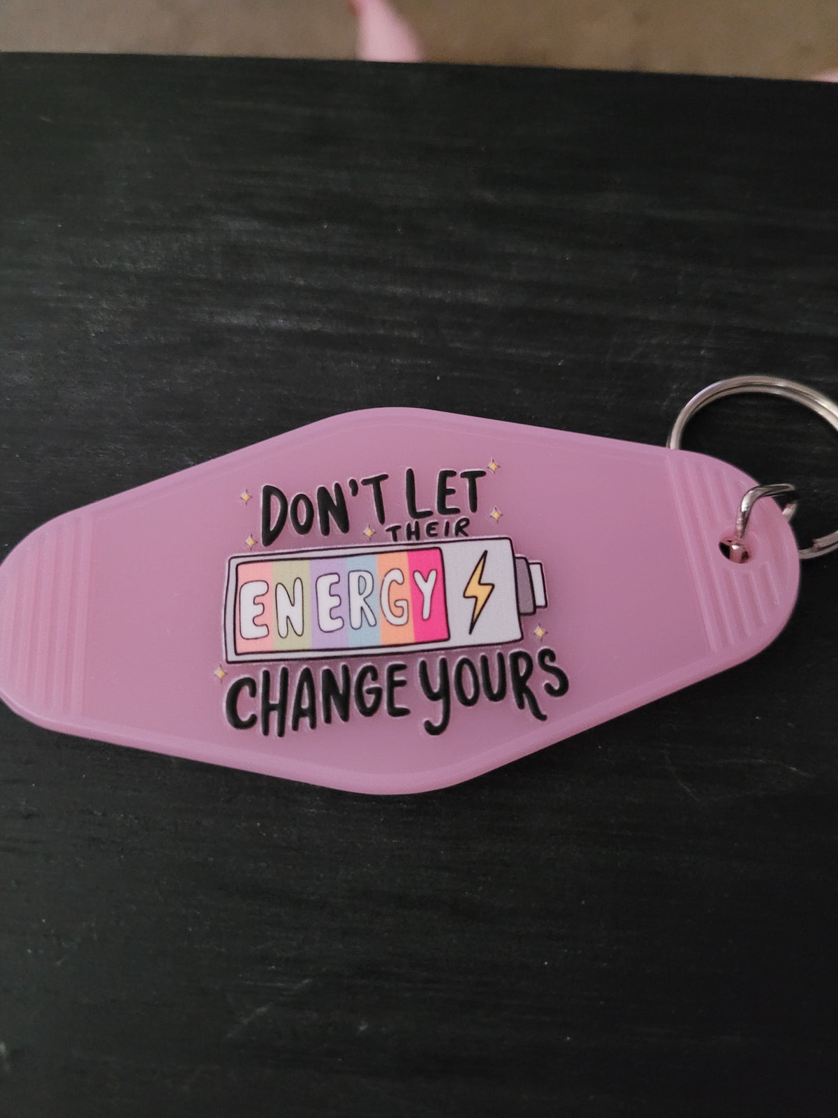 Don't Let Their Energy Change Yours lavender motel-style keychain with colorful battery and lightning bolt