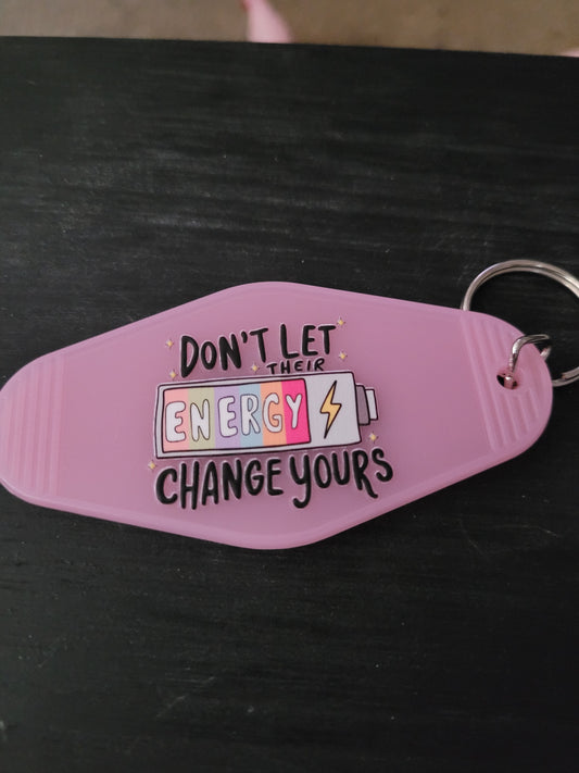 Don't Let Their Energy Change Yours lavender motel-style keychain with colorful battery and lightning bolt