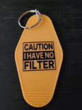 Caution I Have No Filter bold yellow motel-style keychain with black warning label block lettering