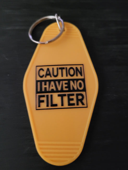 Caution I Have No Filter bold yellow motel-style keychain with black warning label block lettering