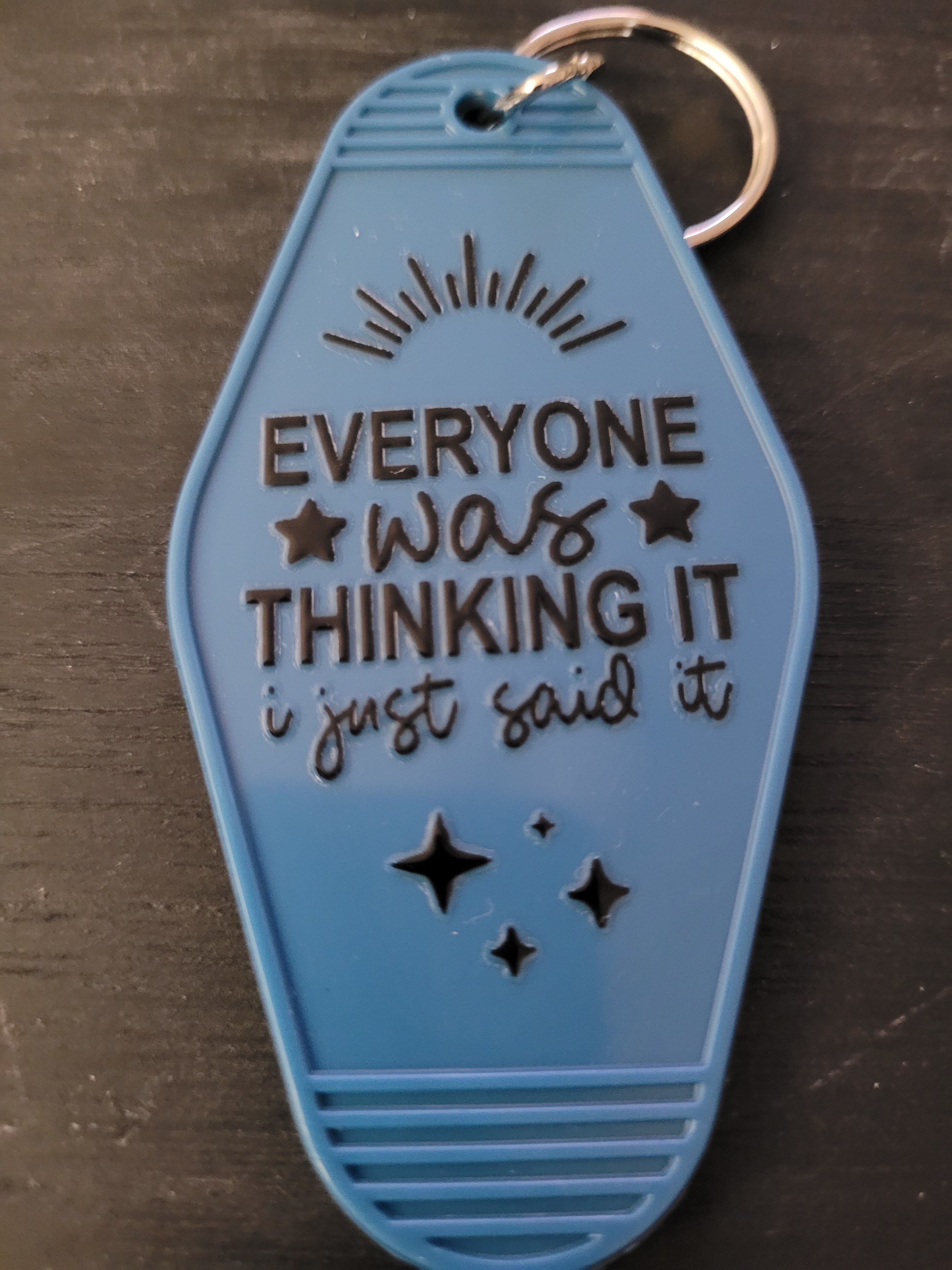 Everyone Was Thinking It I Just Said It slate blue motel-style keychain with sunburst and star accents