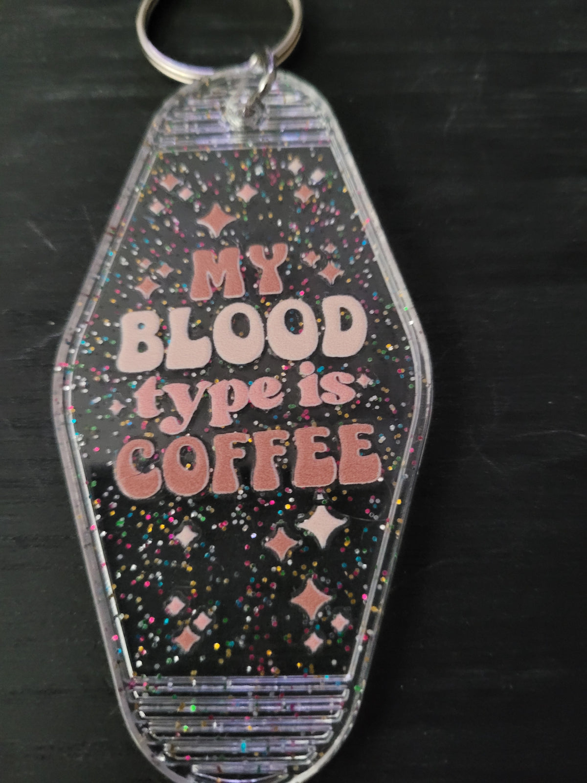 My Blood Type Is Coffee black rainbow glitter motel-style keychain with pink retro lettering and sparkle diamond cutouts