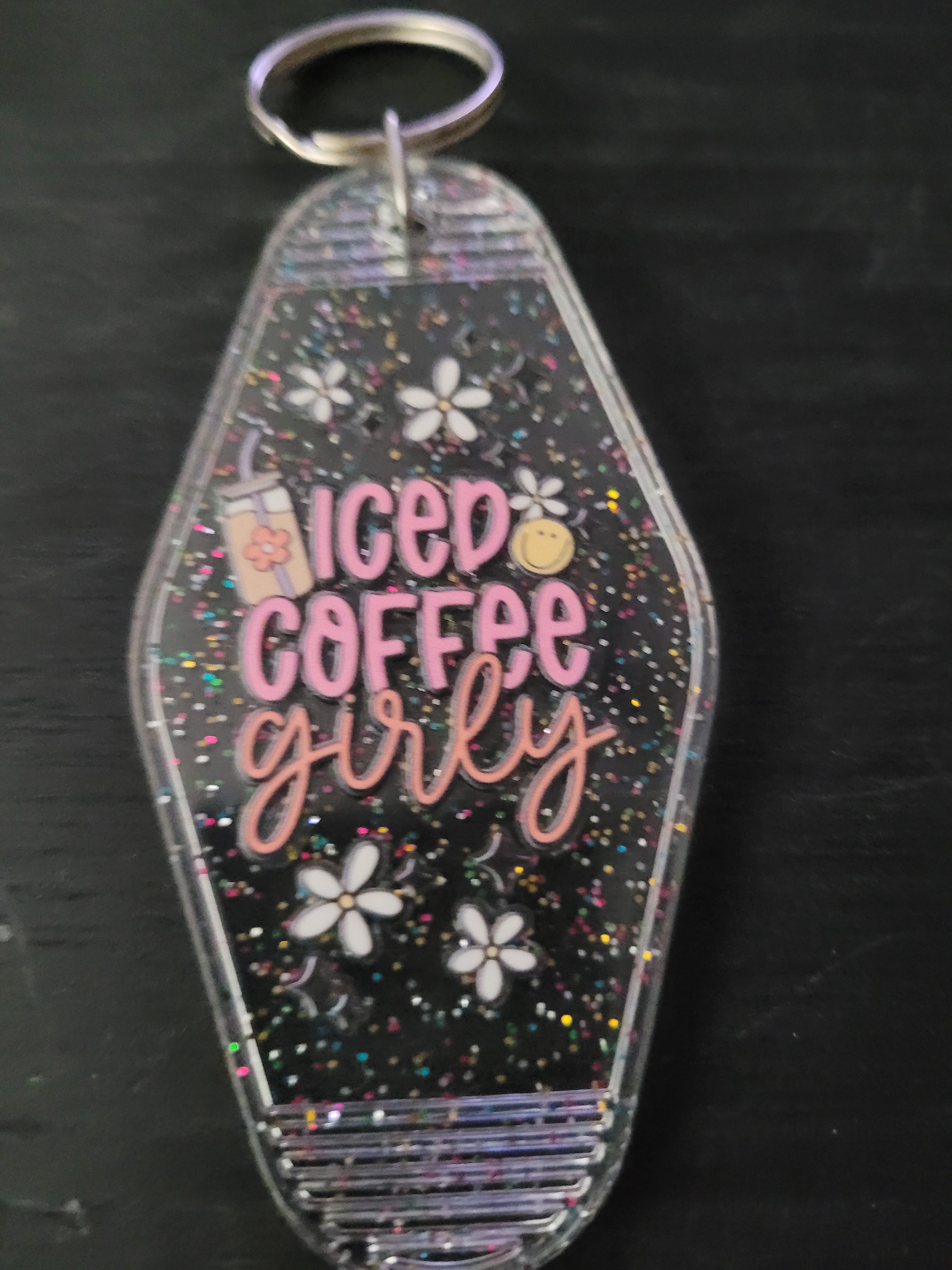 Iced Coffee Girly black rainbow glitter motel-style keychain with pink script lettering, white daisies and coffee cup charm