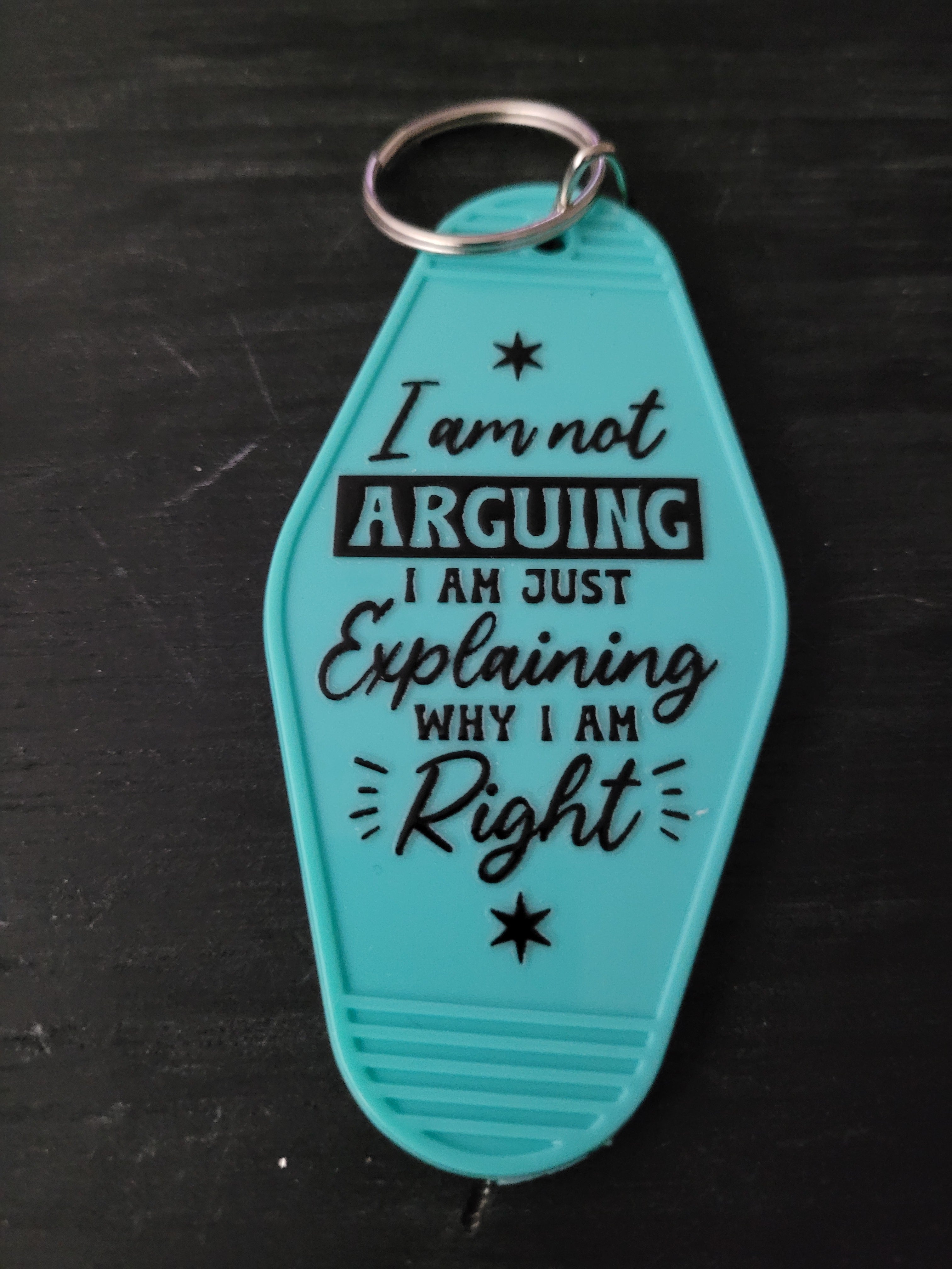 I Am Not Arguing I Am Just Explaining Why I Am Right vibrant teal motel-style keychain with mixed script block and serif lettering
