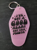 I've Got A Good Heart But This Mouth lilac pink motel-style keychain with bold black chunky groovy lettering and sparkle diamond accents