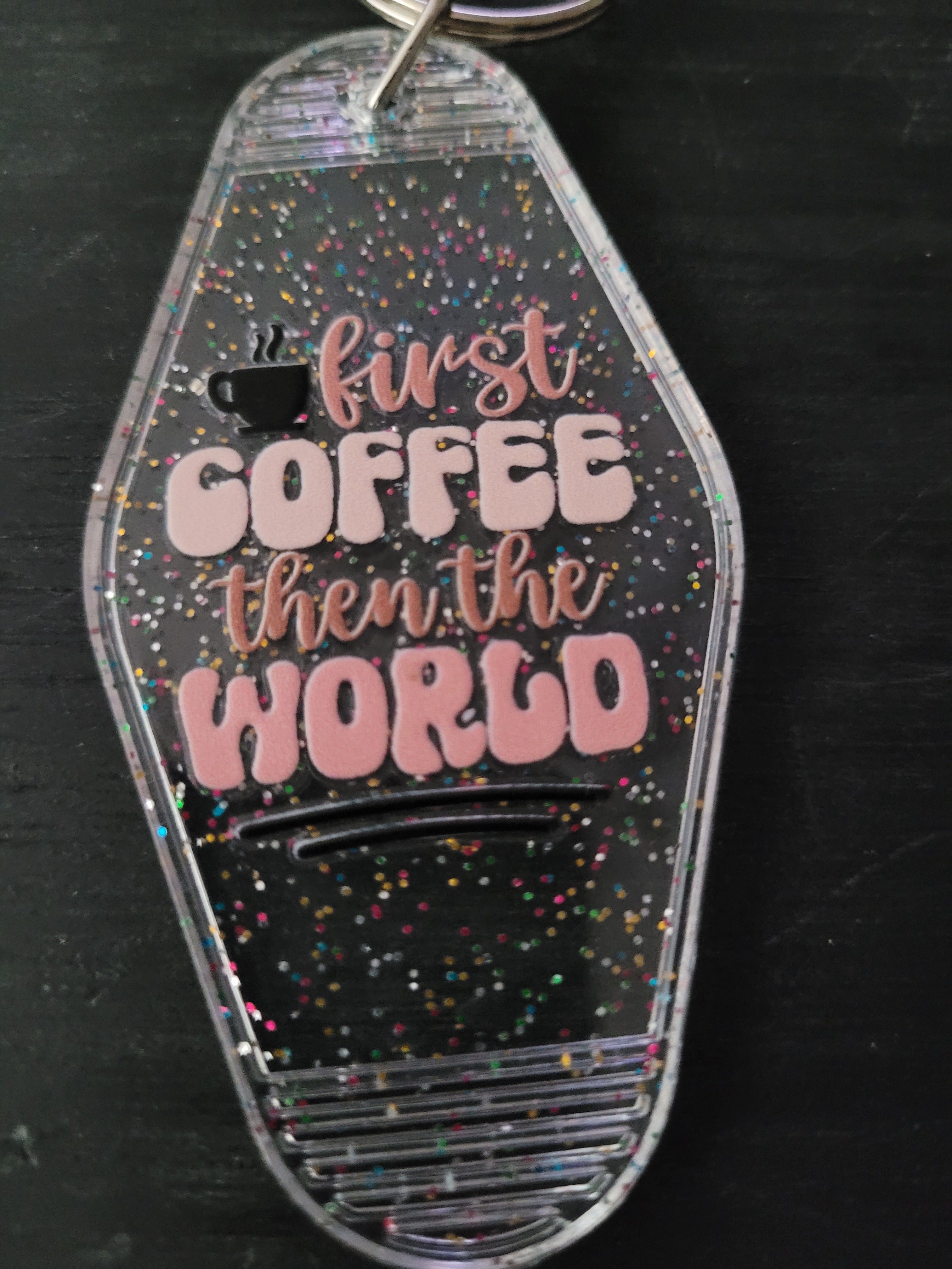 First Coffee Then The World clear rainbow glitter motel-style keychain with steaming coffee cup icon and pink retro lettering
